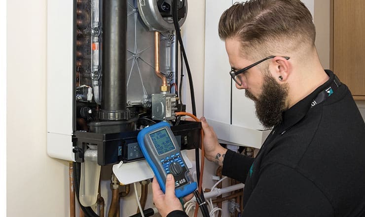 An image of an engineer using a Kane handheld tool